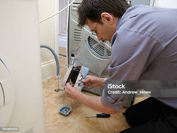 Repair Man Stock Photo - Download Image Now - Dryer, Repairing, Machinery