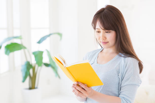 istock woman who reads a book 1143847414