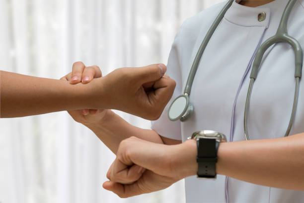 istock Asian Nurse check Patient pulse at wrist by close up shooting 1143847563
