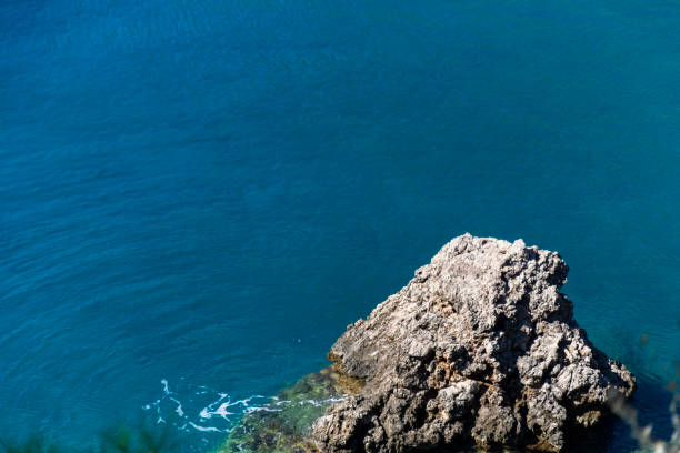 istock Stone cliff in a beautiful blue sea Antalya 1143853028
