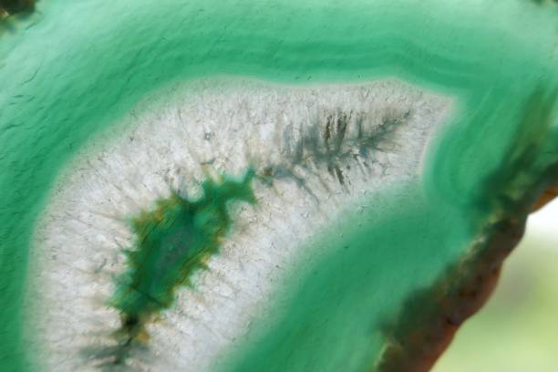 istock Green agate stone macro. Green agate arc slice texture.Natural stone bright Green background. Phone wallpaper 1143858141