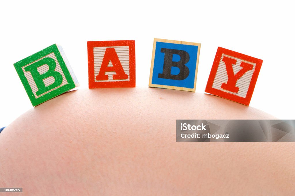 Embarazada bebé de texto - Foto de stock de Abdomen humano libre de derechos