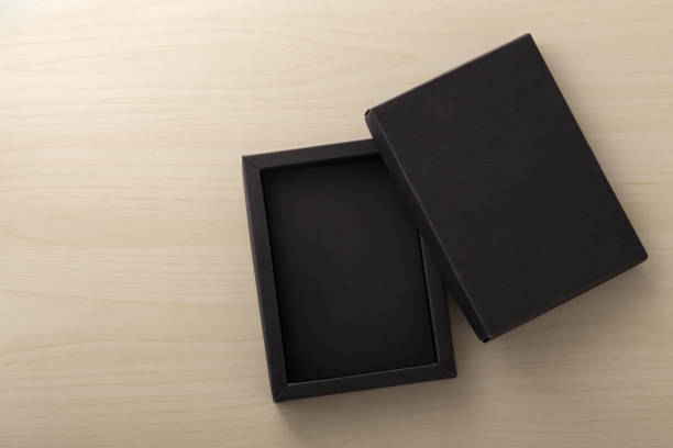istock Black box packaging on wooden background 1143860043