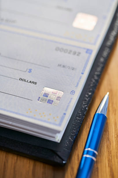 istock Bank Check security padlock icon printed on check to prevent fraud 1143860443