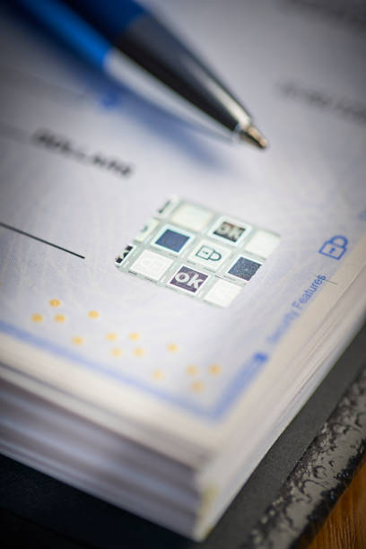 istock Bank Check security padlock icon printed on check to prevent fraud 1143860455