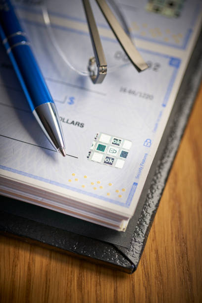 istock Bank Check security padlock icon printed on check to prevent fraud 1143860463