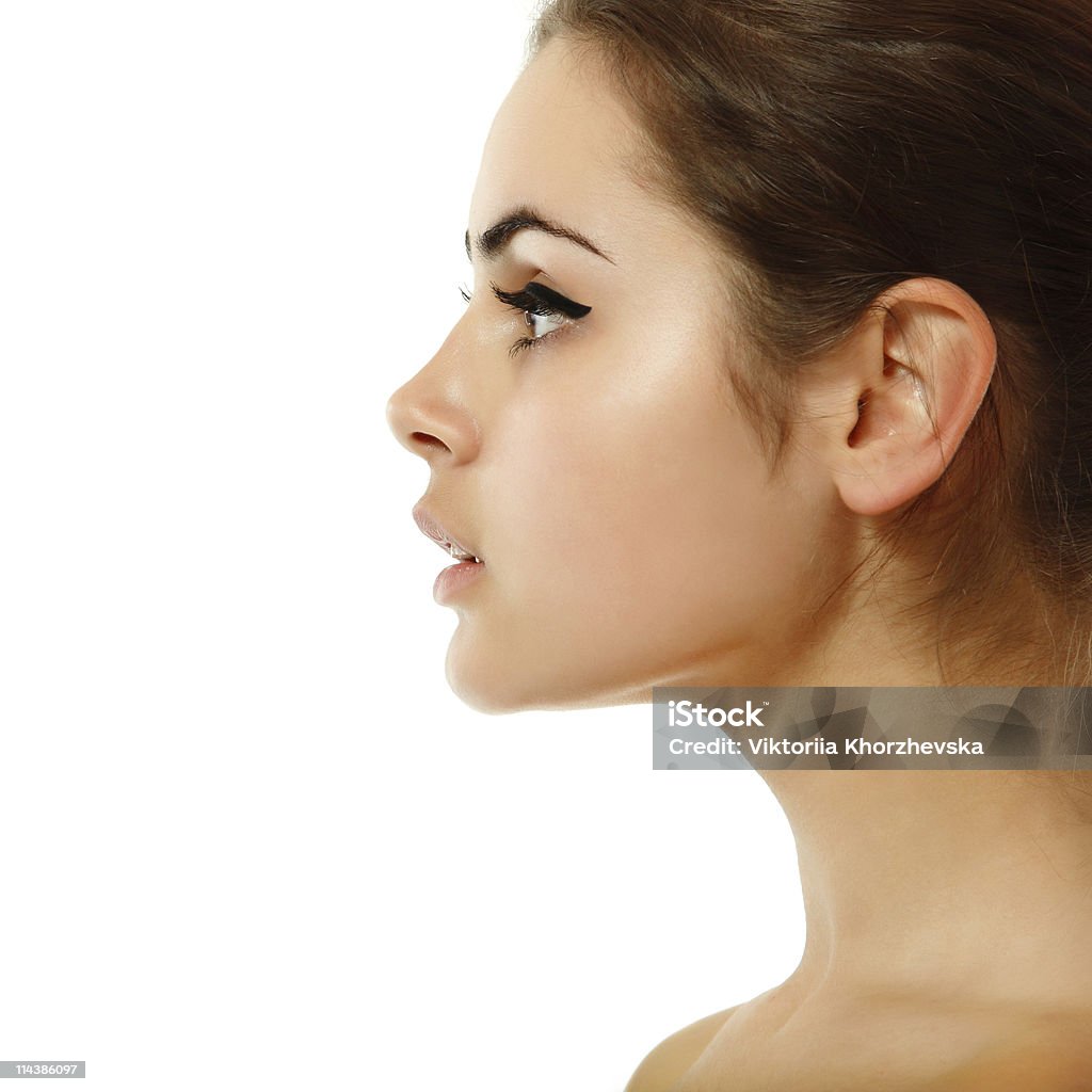 A side view shot of a beautiful young woman woman young teen beauty profile isolated on white background Women Stock Photo