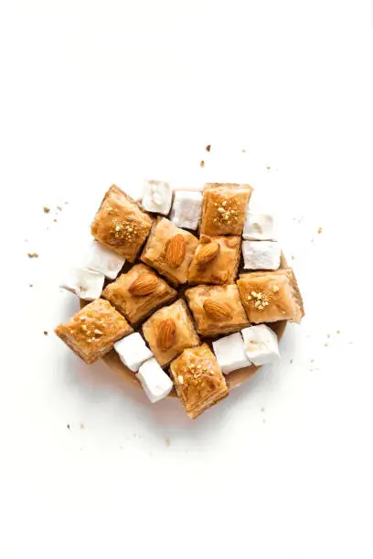 Baklava and Turkish Delights. Arabic Ramadan Dessert Baklava with nuts and honey isolated on white.