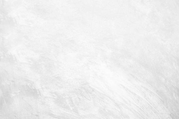 istock White pastel rough crack cement texture stone concrete,rock plastered stucco wall; painted flat fade background gray solid floor grain. 1143863982