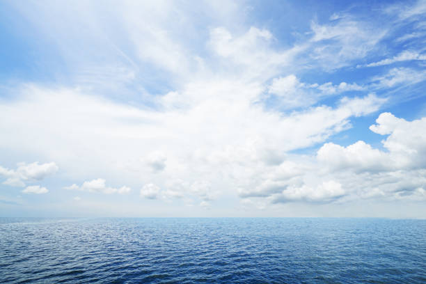 istock The blur cool sea background on horizon tropical sandy beach; relaxing outdoors vacation with heavenly mind view at a resort deck touching sunshine, sky surf summer clouds and light blue wave ocean. 1143865286