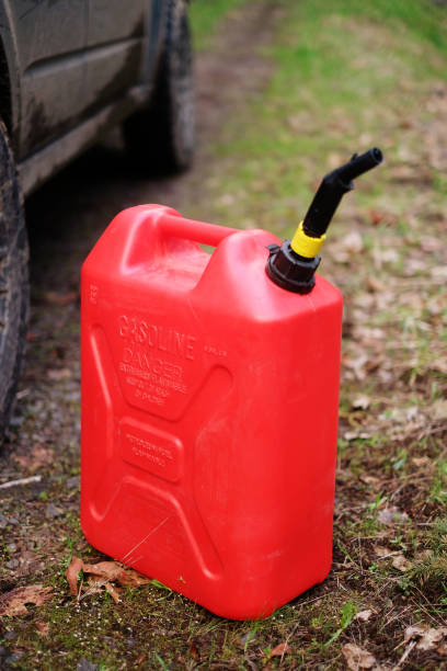 istock Gas Can on Forest Road 1143865432