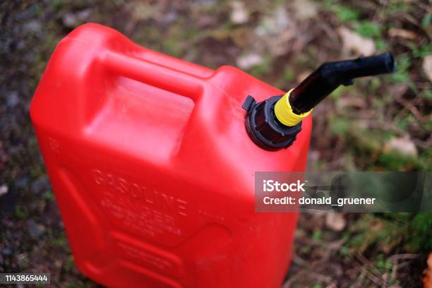 Gas Can On Forest Road Stock Photo - Download Image Now - Gas Can, Pour Spout, Gasoline