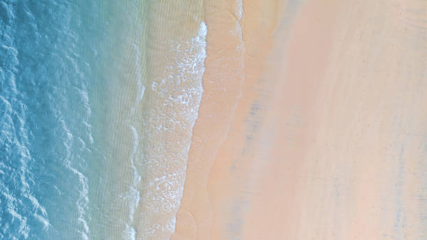 istock Beach with shade emerald blue water and wave foam on tropical sea 1143865590