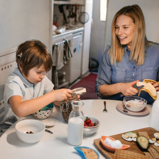 istock Mother And Son With Cochlear Implant Having Healthy Breakfast 1143866523