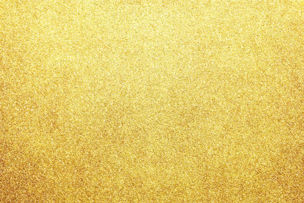 istock gold colored glitter paper texture or vintage background 1143866589