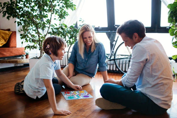 istock Family Playing Board Game 1143867358