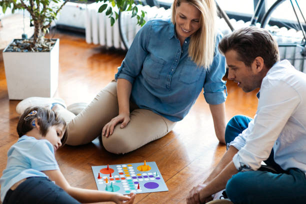 istock Family Playing Board Game 1143867380