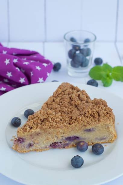 istock Slice of blueberry crumble cake 1143867538