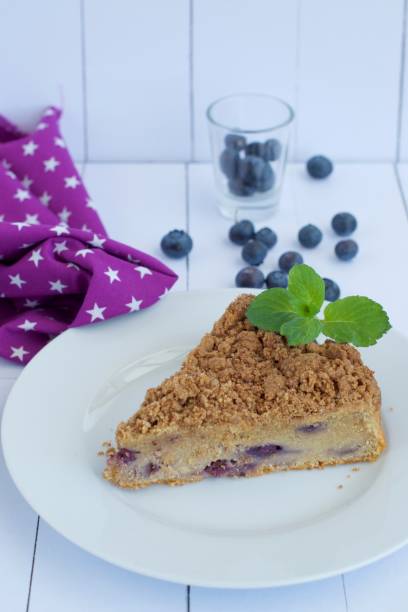 istock Slice of blueberry crumble cake 1143867593