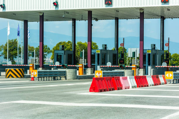 istock Empty pay toll check point - Toll booths at highway 1143868238