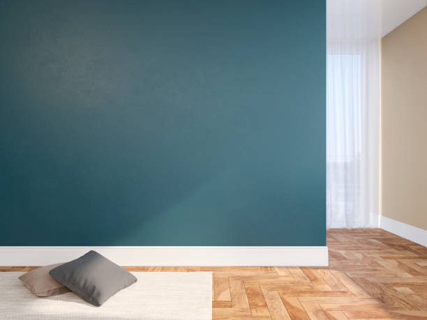 istock Blue blank wall empty interior with pillows, carpet, curtain and herringbone wood floor. 3d render illustration mock up 1143871943