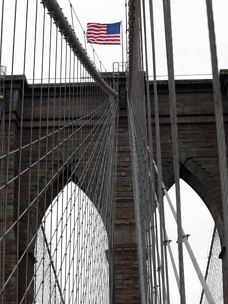 istock Brooklyn Bridge and USA Flag 114387377