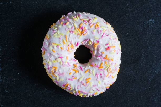 istock Glazed white donut on shale dishes. 1143876090