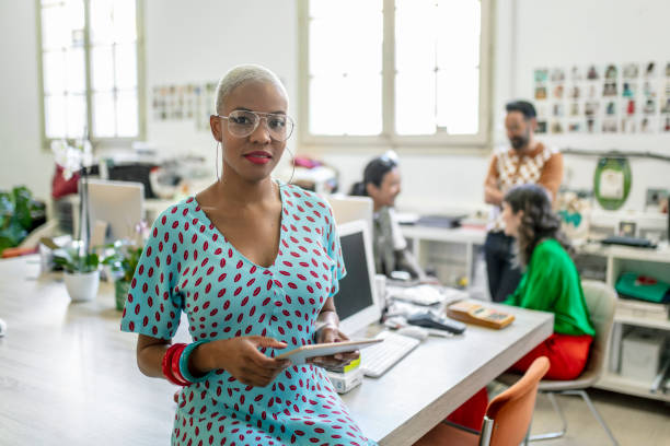 Female fashion designer using digital tablet