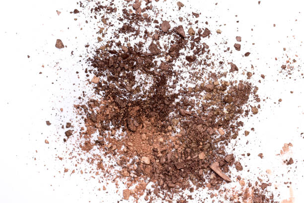istock Deep brown crumbled eye shadow isolated on white background 1143877523