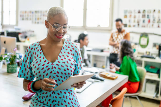 istock Businesswoman using digital tablet at desk 1143877627