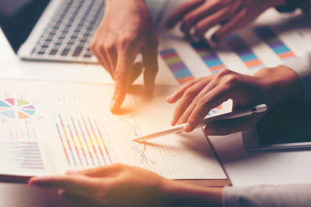 istock Midsection Of Business Colleague Working Over Graphs 1143885198