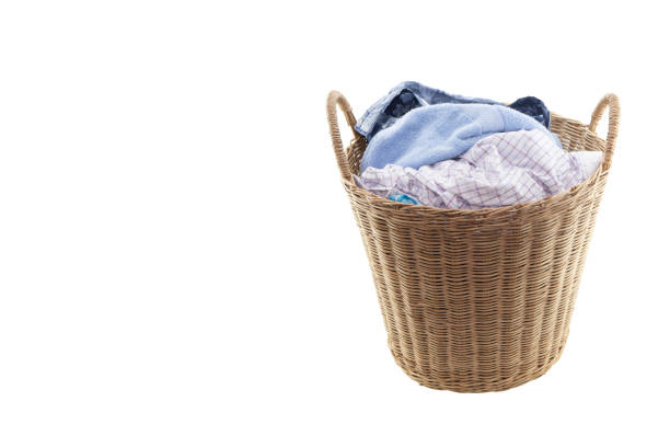 istock Clothes in a laundry wooden basket isolated on white background. Clipping path. 1143890093