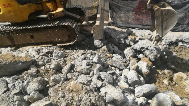 istock soil with crack mortar and branch and machine on floor 1143899179