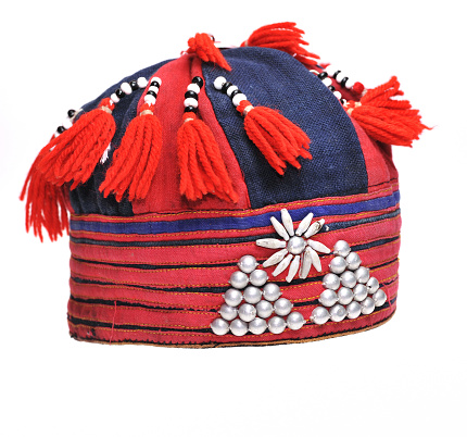 Hat decorated with beads belonging to the Hmong hill tribes of Sapa,Vietnam.Isolated on white.