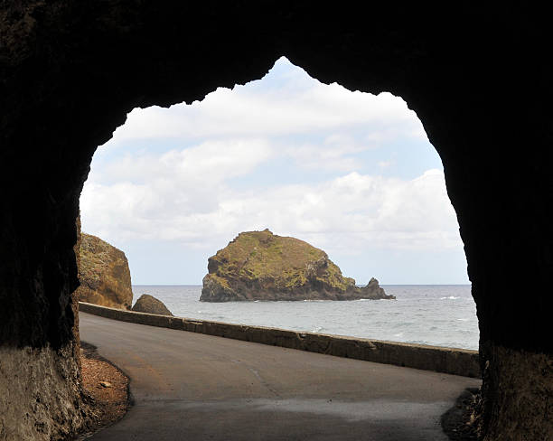 istock Looking  at the ocean through a tunnel made in rocks. 114390171
