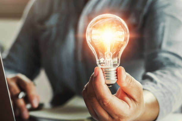 istock hand holding light bulb. idea concept with innovation and inspiration 1143904015