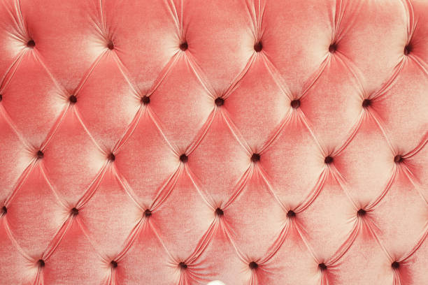 istock Close up view on bright textile of sofa wtih rivets 1143904136