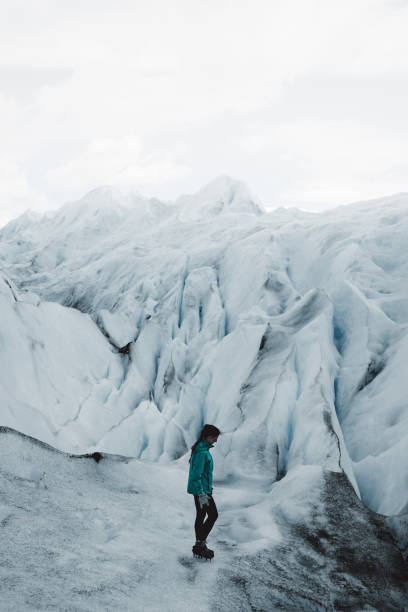 istock Woman hiking on Perito Moreno glacier 1143906772