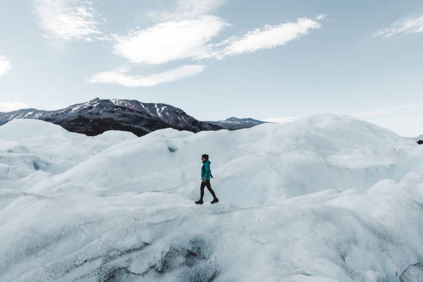 istock Woman hiking on Perito Moreno glacier 1143910177