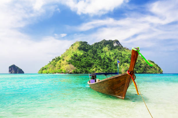 istock Thai traditional wooden longtail boat. 1143910402