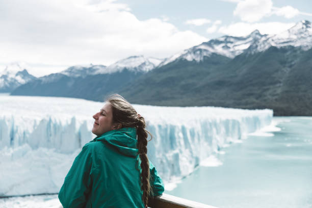 istock Woman looking at Perito Moreno glacier and mountains 1143911051