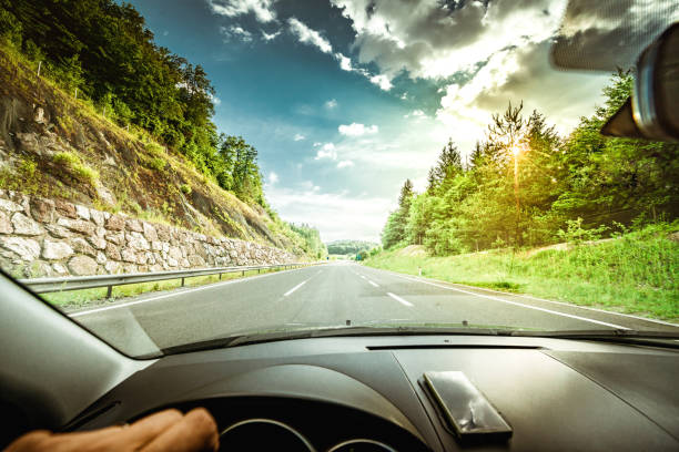 istock driving car on highway road 1143911762