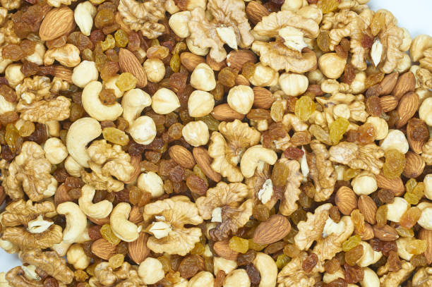 istock raisins nuts almonds cashews hazelnuts walnut mix platter texture 1143911942