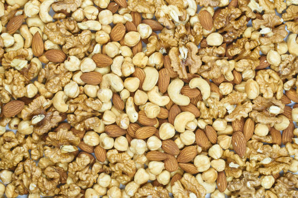 istock raisins nuts almonds cashews hazelnuts walnut mix platter texture 1143911948
