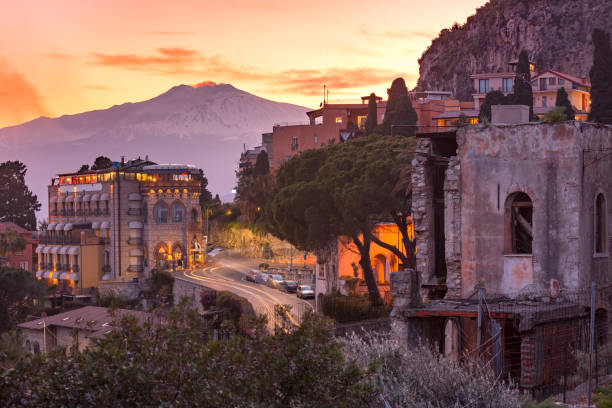 Mount Etna volcano at sunset, as seen from Taormina, Sicily