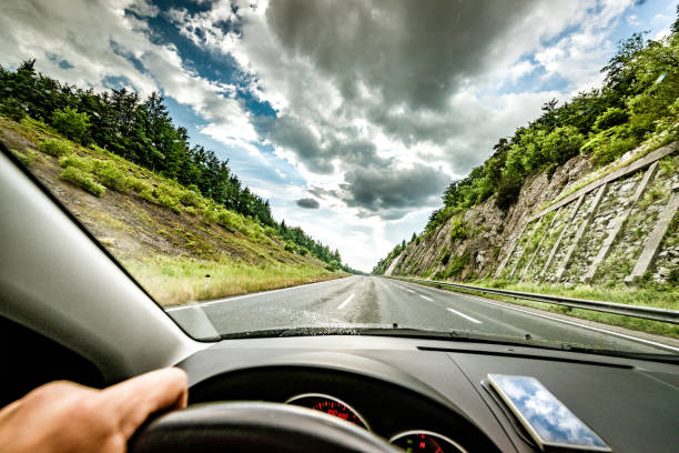 istock driving car on highway road 1143912525