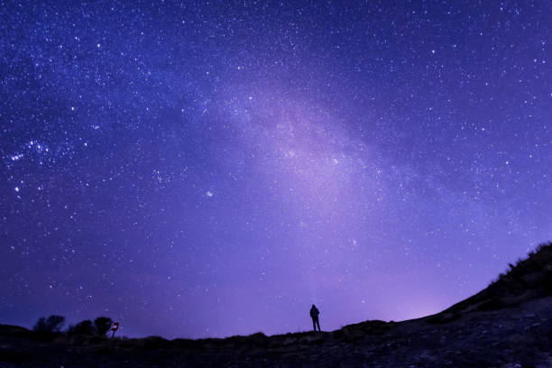 istock Senior Caucasian man starry sky background 1143914101