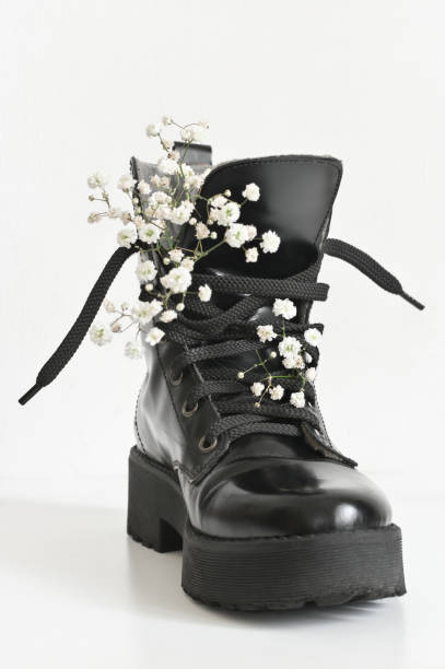 istock Black combat boot decorated of flowers 1143917938