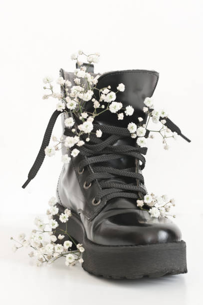 istock Black combat boot decorated of flowers 1143917939