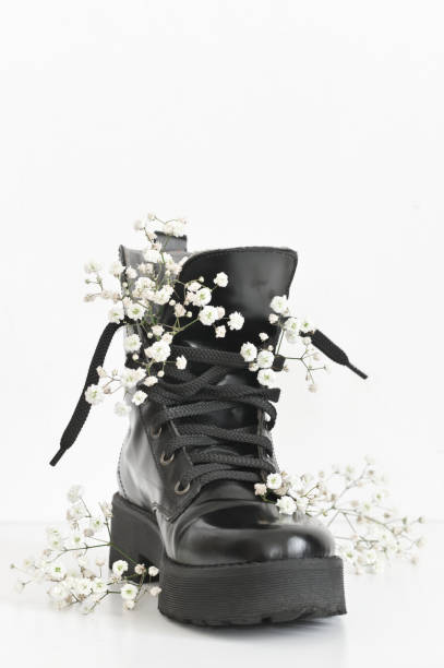 istock Black combat boot decorated of flowers 1143917941